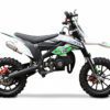 A green and white dirt bike is parked on the ground.