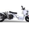 A white three wheeled motorcycle with a black seat.